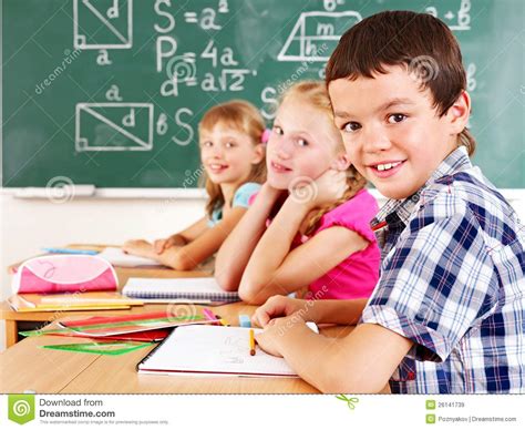School Child Sitting In Classroom Royalty Free Stock