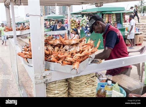 A Street Vendor Sells Crab And Other Food From A Stall On Galle Face