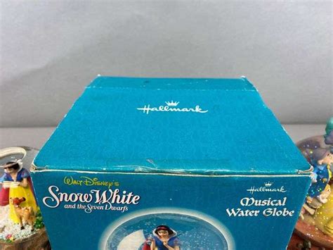 Group Of 2 Disney Snow White And The Seven Dwarfs Musical Snow Globes