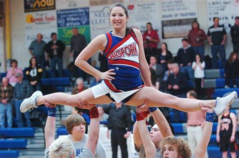 A Split Sit Stunt Is Demonstrated In This Picture Cheerleading