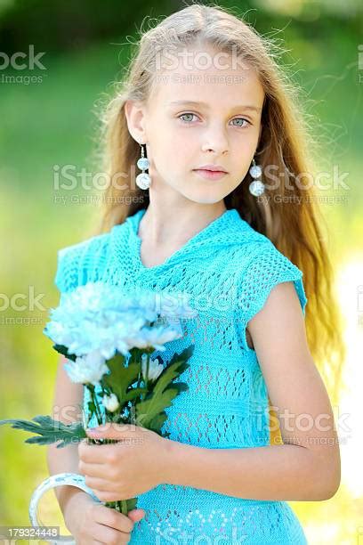 Portrait Of Little Girl Outdoors In Summer Stock Photo Download Image