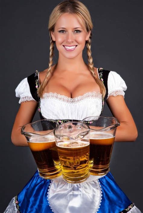 German Barmaid In Braids Wearing Dirndl And Holding Pitchers Of Beer Beer Girl German Beer