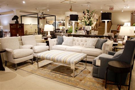 White Couch With Two Matching Accent Chairs And A Stripped Ottoman