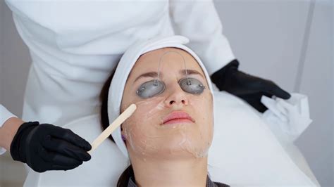 Close Up Shot Of Preparing Facial Skin For Broadband Laser Treatment Cosmetologist Applying