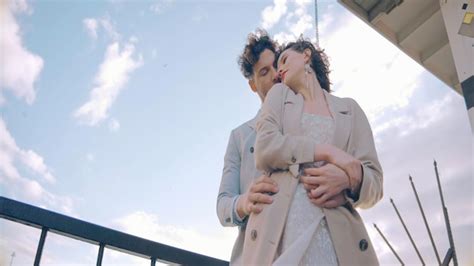Premium Photo Stylish Newlyweds Embrace On Background Of Sunlight Action Gentle Couple In