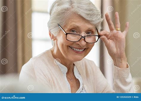 Senior Woman Holding Eyeglasses Stock Image Image Of Hand Older 125353329