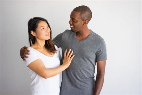 Free Photo Romantic Portrait Of Interracial Couple Smiling To Each Other