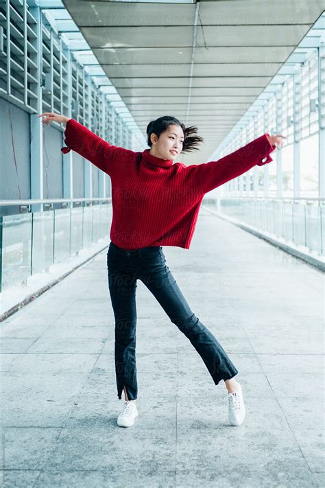 Asian Teenage Girl Dancing In City Street By Pansfun Images Dancing