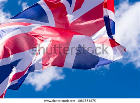 British Flag Waving Wind Against Blue Stock Photo 1083581675 Shutterstock