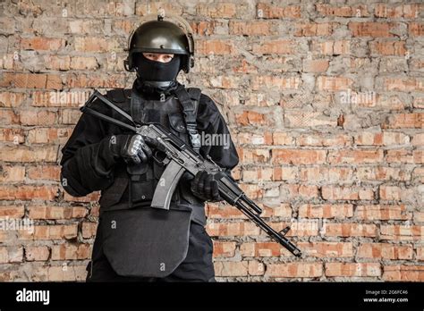 Special Forces Operator In Black Uniform And Bulletproof Stock Photo