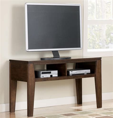 Ashley furniture offers a fully integrated product line that takes the guesswork out of furnishing your home. Signature Design by Ashley Deagan TV Stand - Item Number: T334-10 | Tv stand wood, Dark wood tv ...