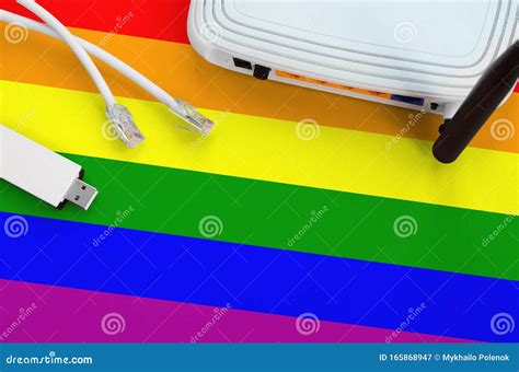 Lgbt Community Flag Depicted On Table With Internet Rj45 Cable Wireless Usb Wifi Adapter And
