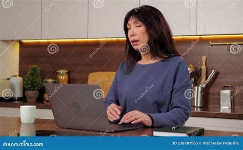 Tired Aged Woman Works Laptop Rubs Neck Stretches Tense Muscles Long