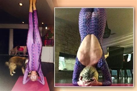 Miley Cyrus Swaps Twerking For A Head Stand And Shows Off Her Bare Back