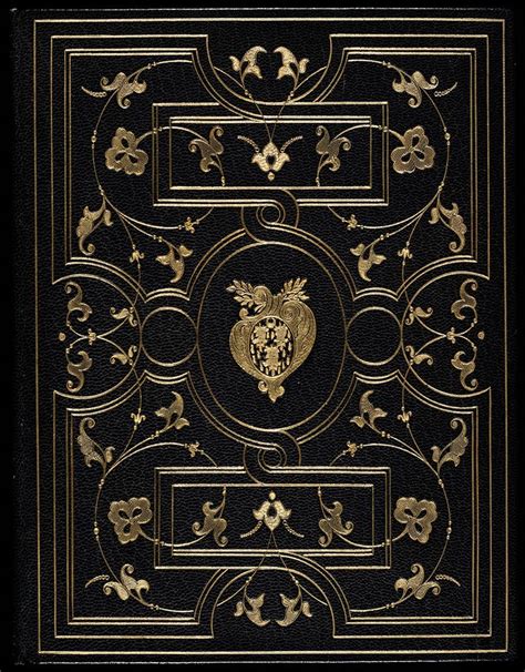 An Old Book With Gold Designs On Black Paper And White Trimmings