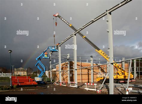 Crane Lifting Steel Beams On Construction Site Stock Photo Alamy