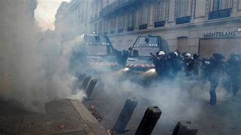 French Police Fire Tear Gas At Protesters In Central Paris Macron