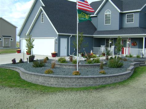 Front yard flag pole ideas. Large Stone Patio with Colorful Rock Bed Edging - Oasis ...