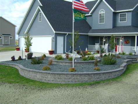 These beds should match (or at least align with) the beds at the front of your house. Large Stone Patio with Colorful Rock Bed Edging - Oasis ...