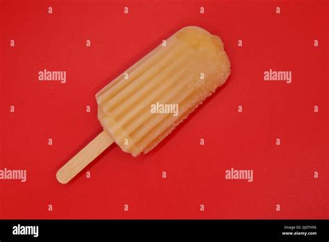 Orange Popsicle Isolated On Red Background Bright Color Summer Mood