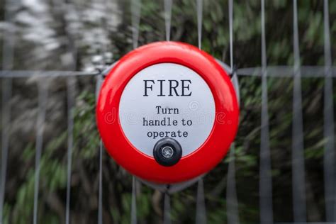 Bright Red Fire Alarm Bell Turn Handle Spin Around To Operate Alert