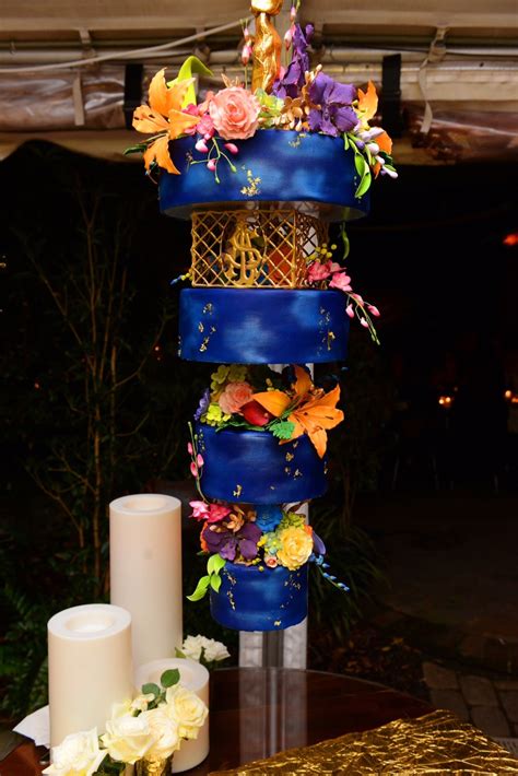 Suspended from a chandelier, hanging upside down… see for yourself. Chandelier Cake Stand by Cake Stackers™