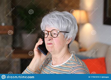 Angry Senior Woman On The Phone Stock Photo Image Of Indoors Aging
