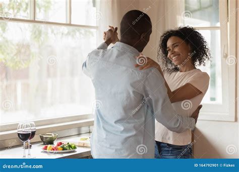 Loving African American Couple Dancing Enjoy Date At Home Stock Image