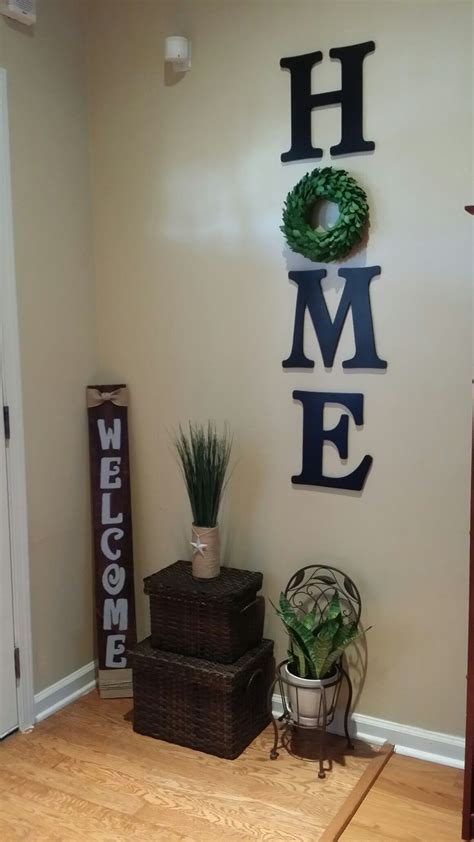 I think my kids will love it also if i try to made this one in our home. Wood letters HOME with wreath wall decor. | Wreath wall ...