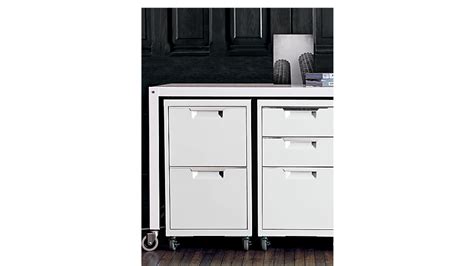 The whitewood 2 drawer lateral size file cabinet is a perfect piece for a home office. TPS white 2-drawer filing cabinet | CB2