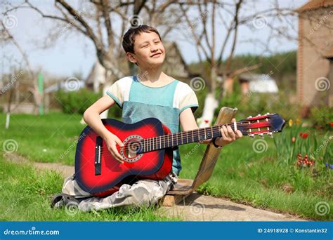 Boy Playing The Guitar Outdoors Stock Photo Image Of Education Note