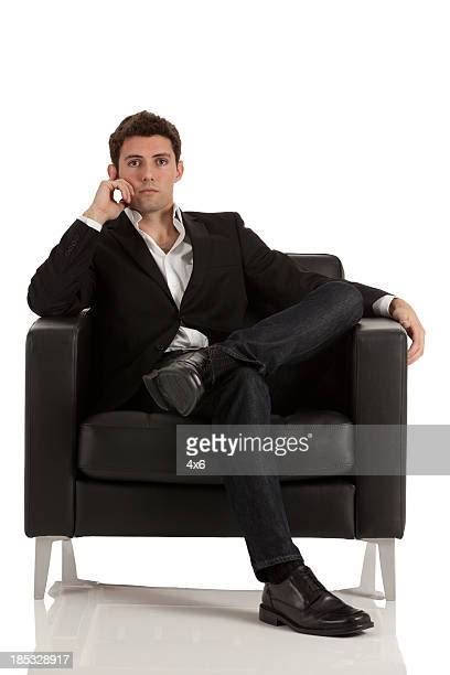 Legs Crossed At Knee Stock Photos And Pictures Getty Images