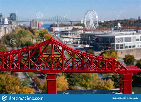 Red Model Of Jacques Cartier Bridge In Front Of Panoramic View Of