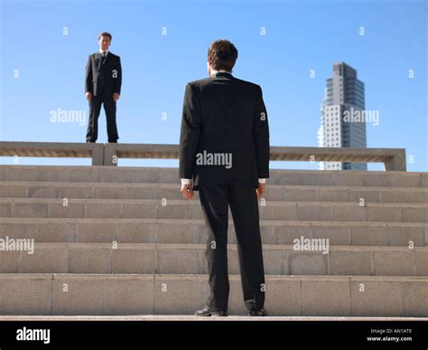 Businessman Standing In Opposite Pose Hoodoo Wallpaper