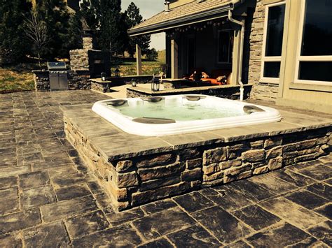 This Bullfrog Hot Tub In Castle Rock Colorado Has Beautiful Stone Surround That Matches The