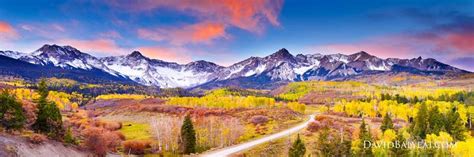 A Scenic View Of The Mountains And Trees In Autumn With Colorful