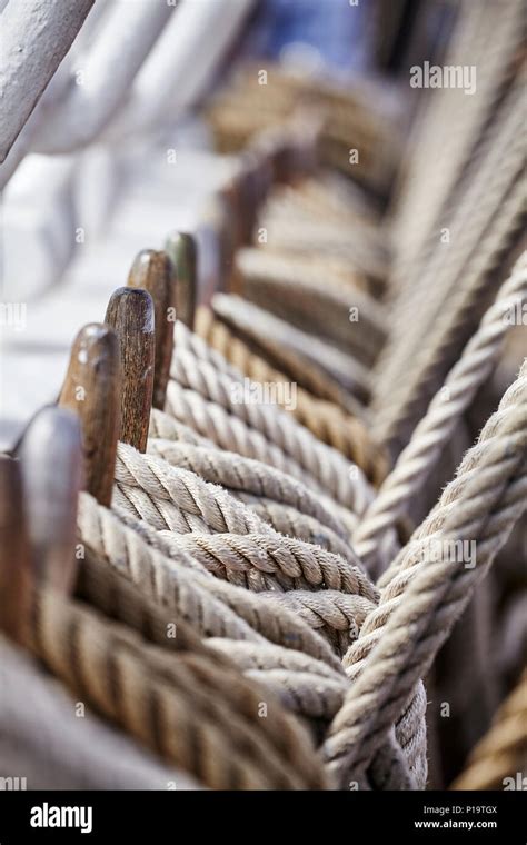 Old Sailing Ship Rigging With Belaying Pins And Ropes Shallow Depth Of