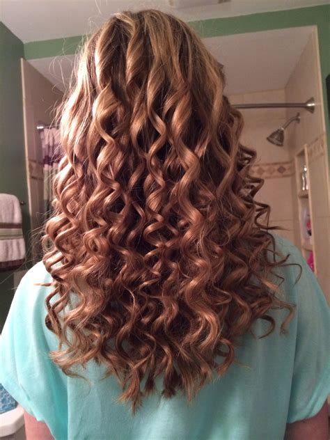 A spiral perm uses longer rods than regular perming and that is how stylists are able to create this sort of tight ringlet. Pin by Erin Lasher on Cute hair | Long hair perm, Permed ...