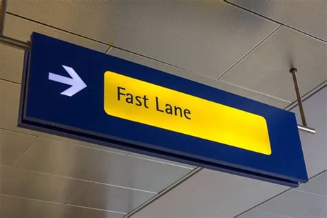 Fast Lane Sign In Blue And Yellow At The Airport Stock Image Everypixel
