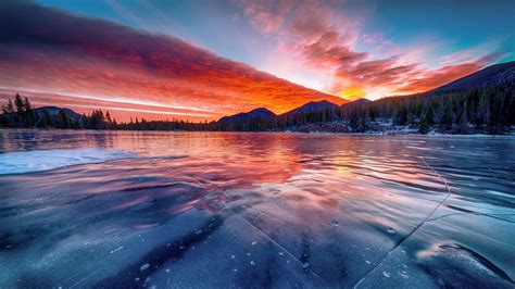 Download Frozen Lake Sunset Winter Skyline Nature 1366x768