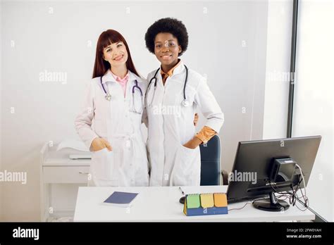 Pretty Two Young Multiethnical Women Doctors African And Caucasian