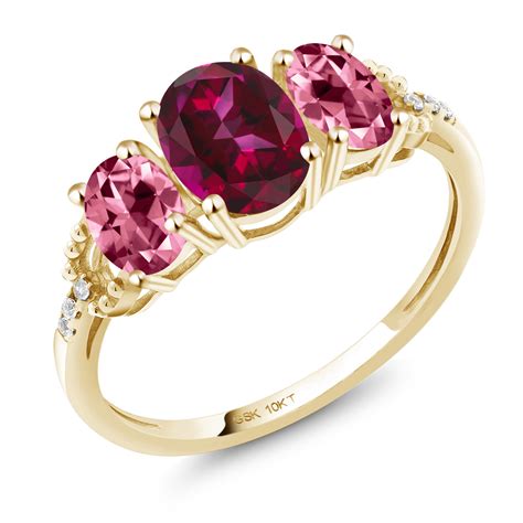 10k Yellow Gold 3 Stone Ring 7x5mm Set With Blazing Red Topaz From
