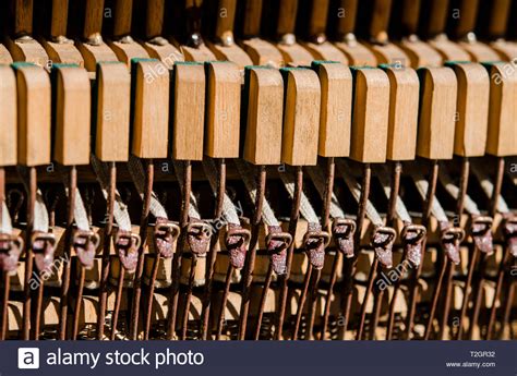 Old Wooden Piano Keys Under The Rays Of The Sun Closeup Stock Photo