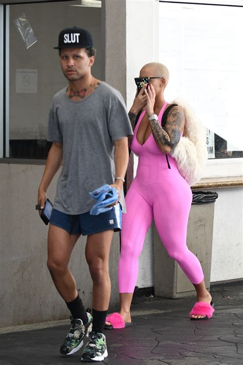 amber rose hides her face after admitting to getting work done