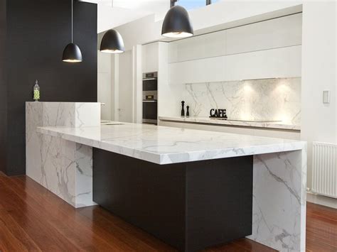 Texture of natural black marble with lots of white veins. Kitchen with privacy bench for the sink. | Kitchen island ...