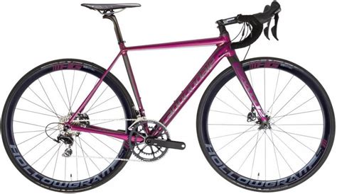 A Purple Bike Is Shown Against A White Background