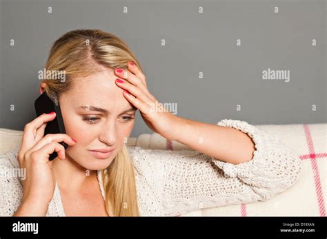 Worried Woman On Cell Phone Stock Photo Alamy