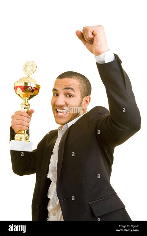 Happy Manager Cheering With A Trophy In His Hand Stock Photo Alamy