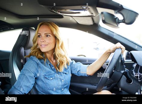 Smiling Woman Driving Car Stock Photo Alamy