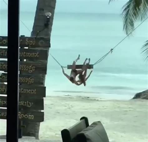 watch viral video of bikini clad woman falling off swing on beach travel news travel
